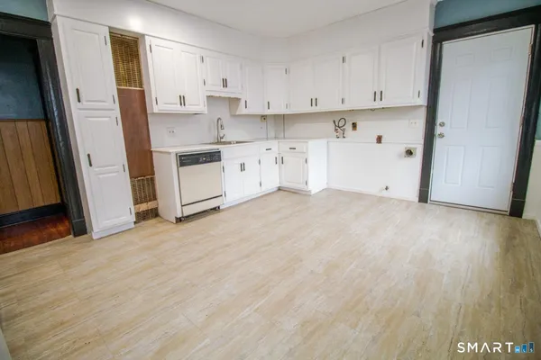 a view of kitchen with wooden floor