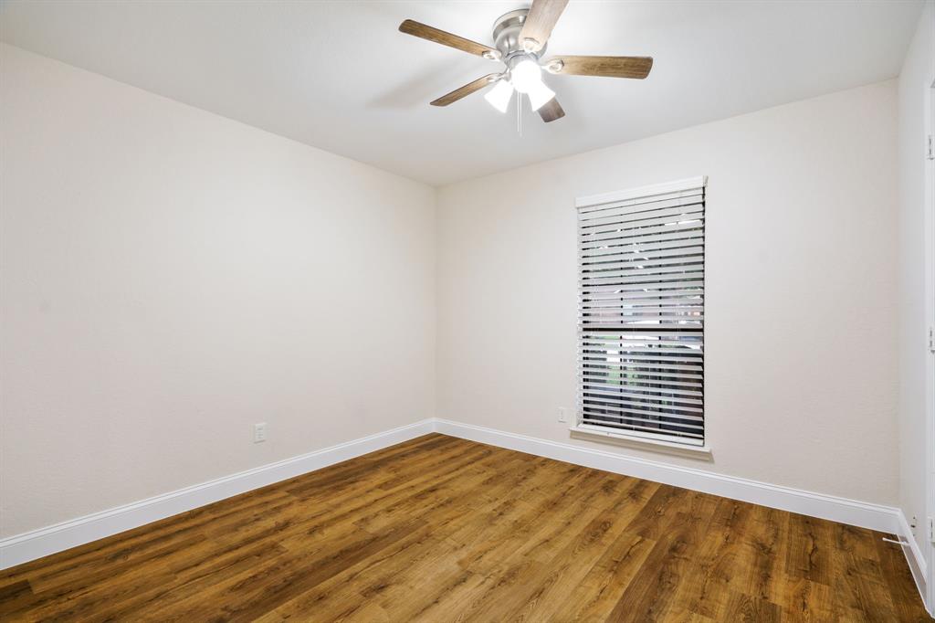 2017 Stein Way Carrollton, TX 75007 - Photo 12 of 18 an empty room with a window and ceiling fan