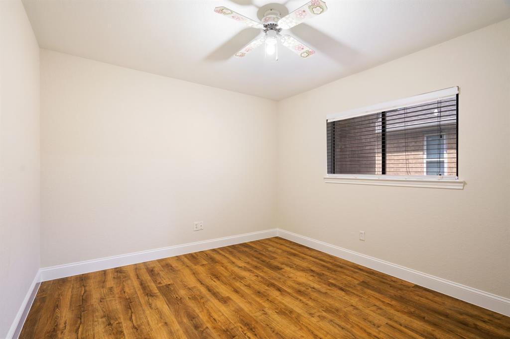 2017 Stein Way Carrollton, TX 75007 - Photo 15 of 18 a view of empty room with wooden floor