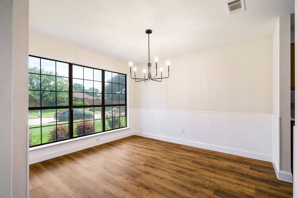 2017 Stein Way Carrollton, TX 75007 - Photo 18 of 18 a view of empty room with wooden floor and fan