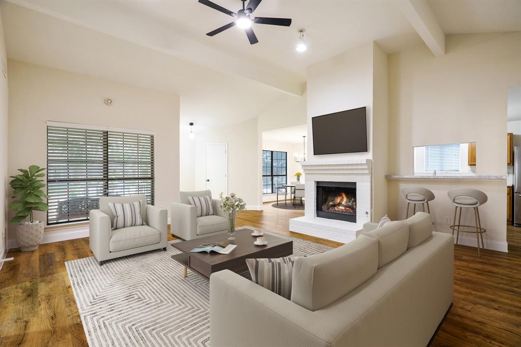 2017 Stein Way Carrollton, TX 75007 - Photo 2 of 18 a living room with furniture fireplace and a flat screen tv