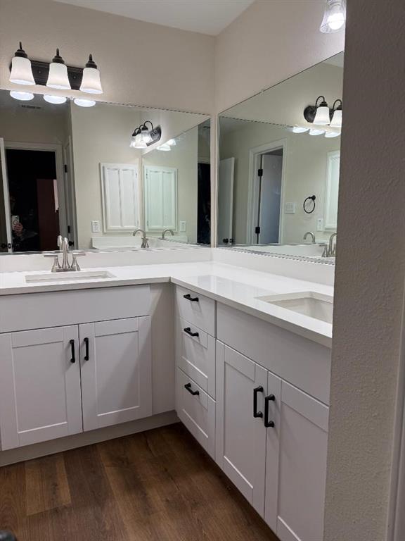 2017 Stein Way Carrollton, TX 75007 - Photo 7 of 18 a spacious bathroom with a double vanity sink a mirror and a bathtub