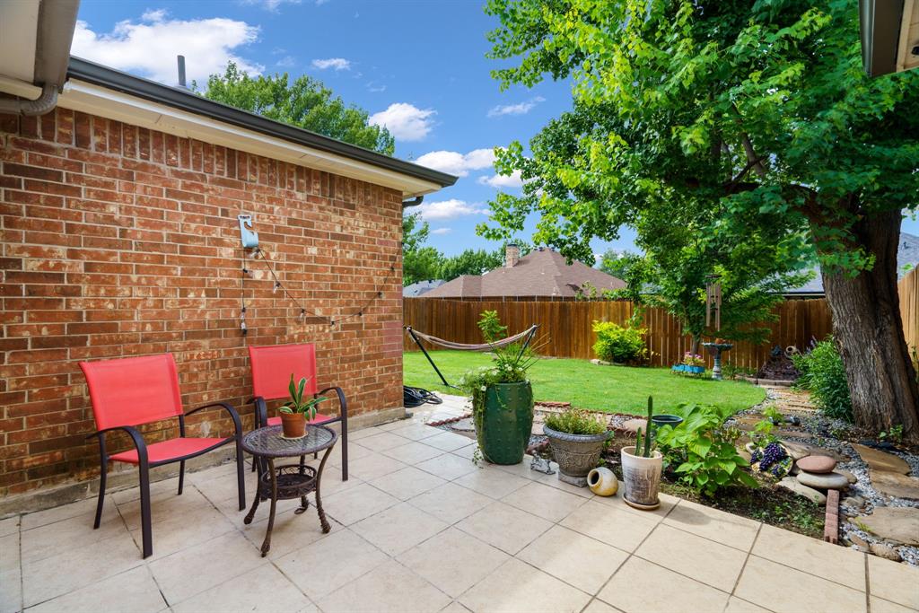 2017 Stein Way Carrollton, TX 75007 - Photo 9 of 18 a backyard of a house with a table and chairs