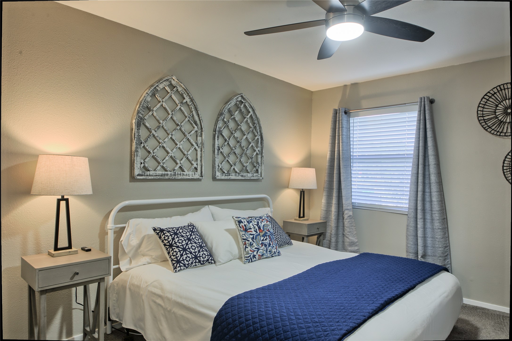 157 Comanche Point Leander, TX 78645 - Photo 17 of 36 a bedroom with a bed and a lamp