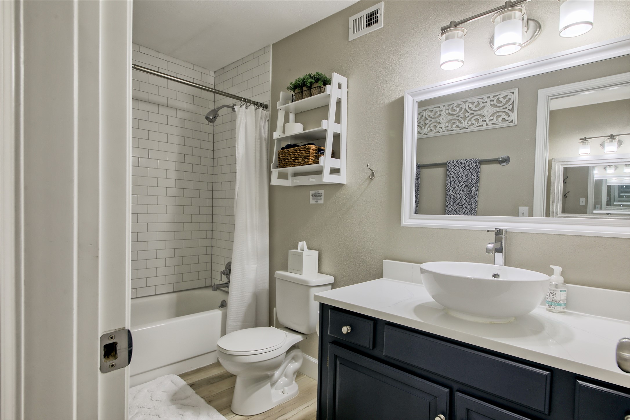 157 Comanche Point Leander, TX 78645 - Photo 31 of 36 a bathroom with a sink a toilet a mirror and shower