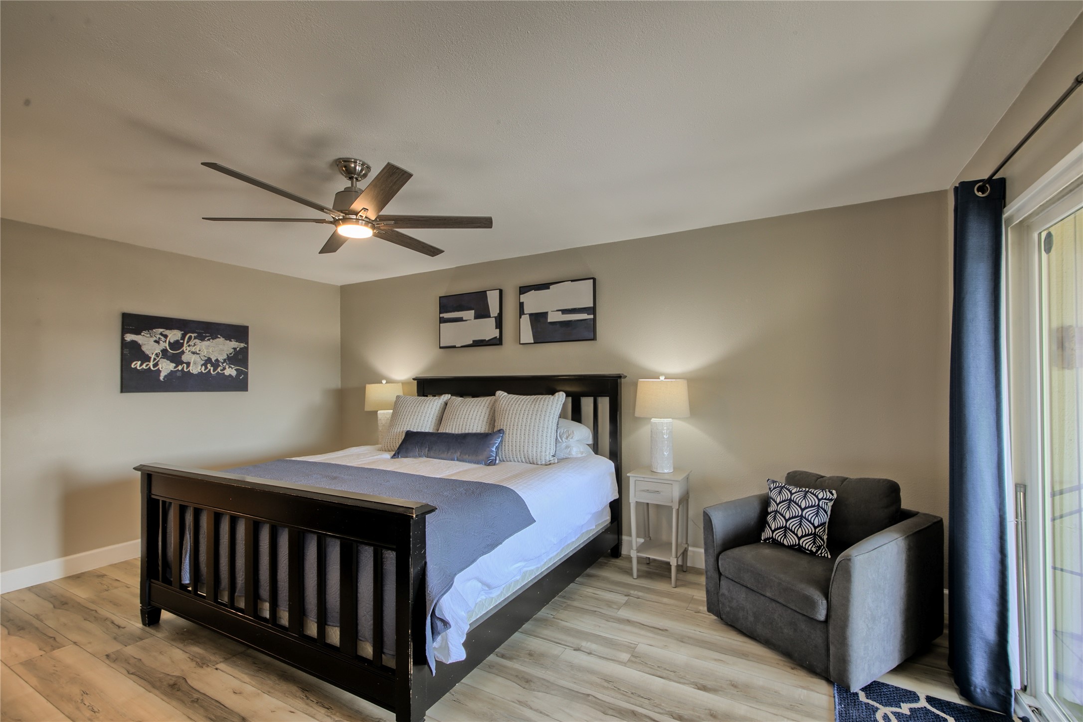 157 Comanche Point Leander, TX 78645 - Photo 32 of 36 a bedroom with a bed and a chandelier