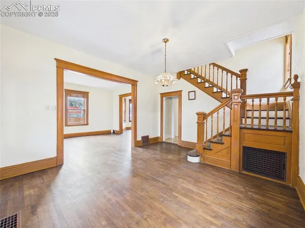 a view of an entryway with wooden floor