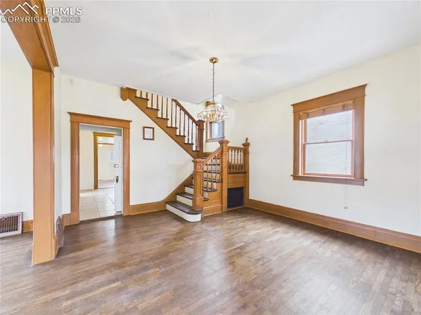 a view of an entryway with wooden floor