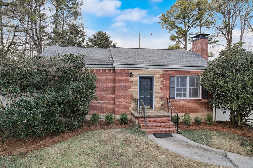 front view of a house with a yard