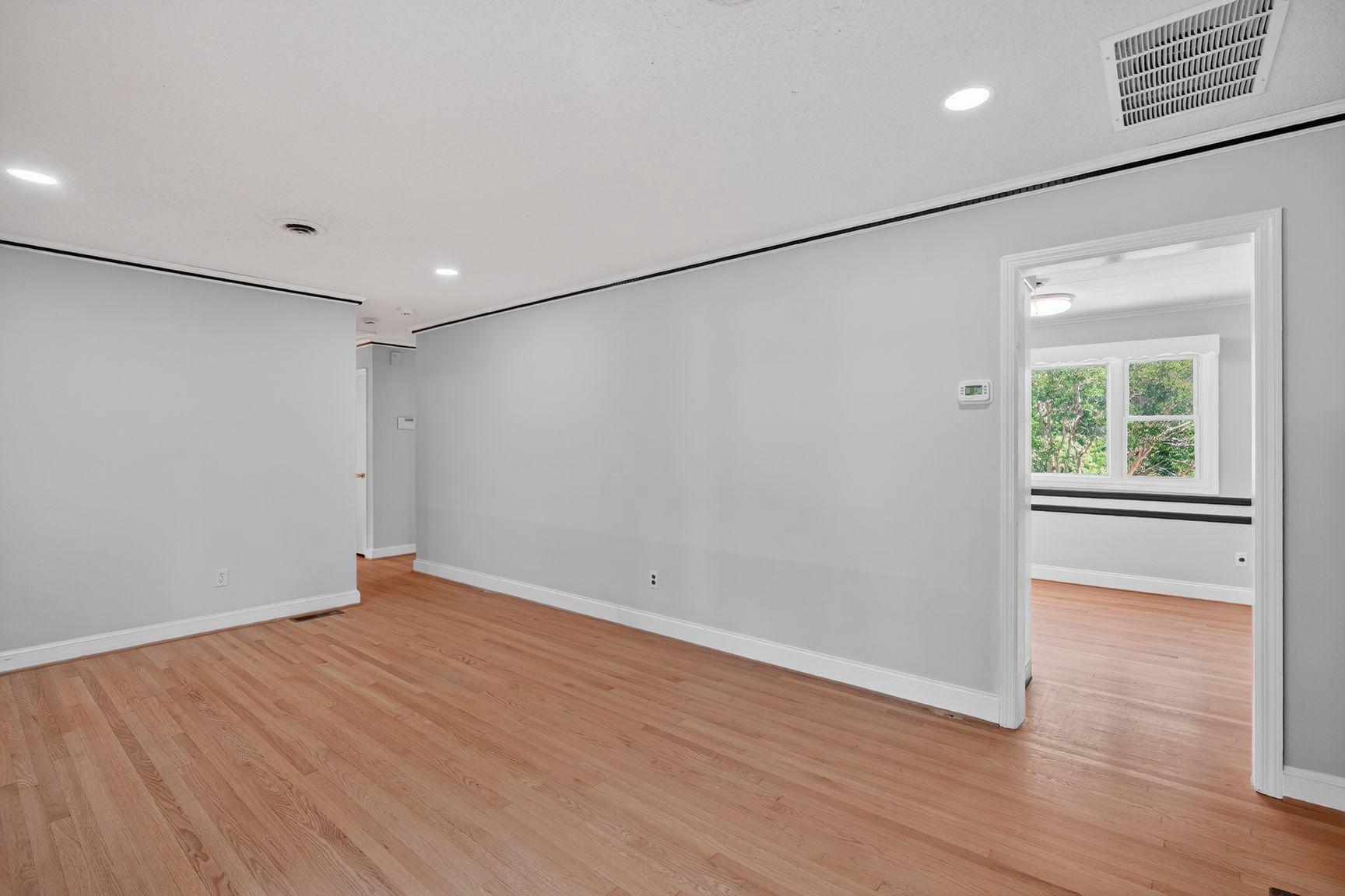 4202 Yates Road Beltsville, MD 20705 - Photo 4 of 31 Spacious, light-filled living area with hardwood.