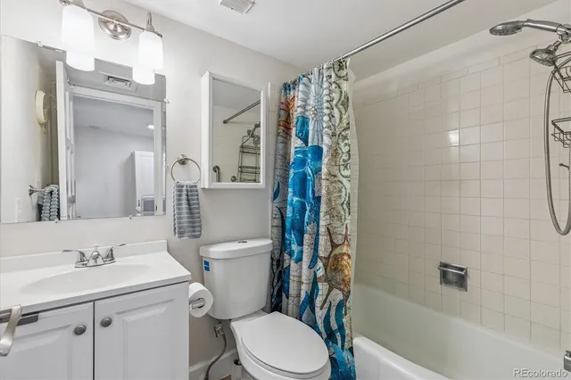 a utility room with sink dryer and washer