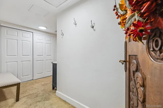 a view of a hallway with paintings on the wall
