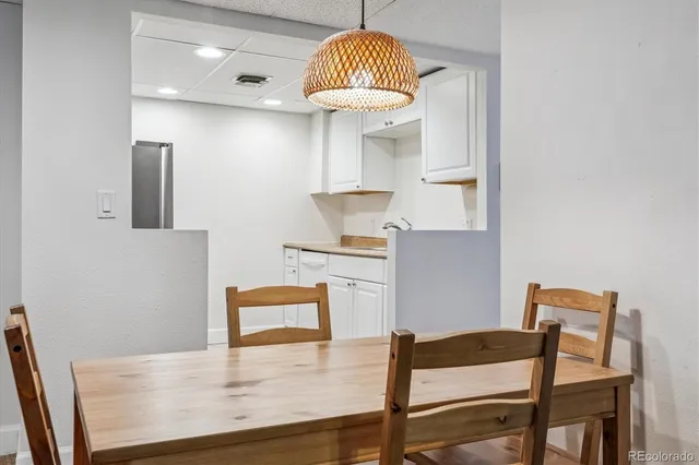 a kitchen that has a sink a microwave oven and a cabinets