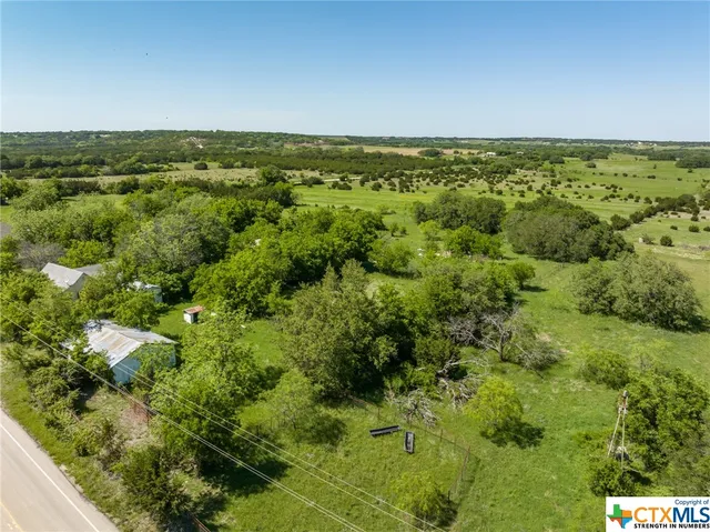 a view of a lake with a yard
