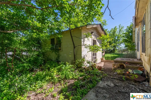 a backyard of a house with lots of green space