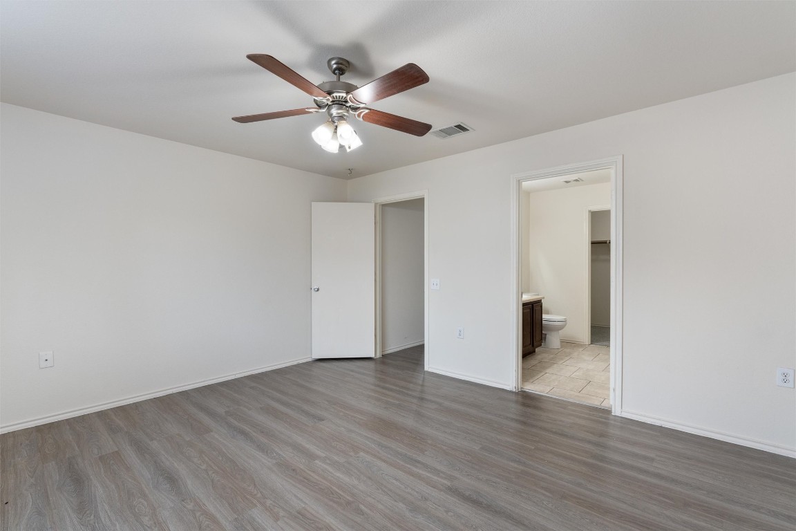 7432 Cayenne Lane Austin, TX 78741 - Photo 13 of 30 a view of an empty room and wooden floor