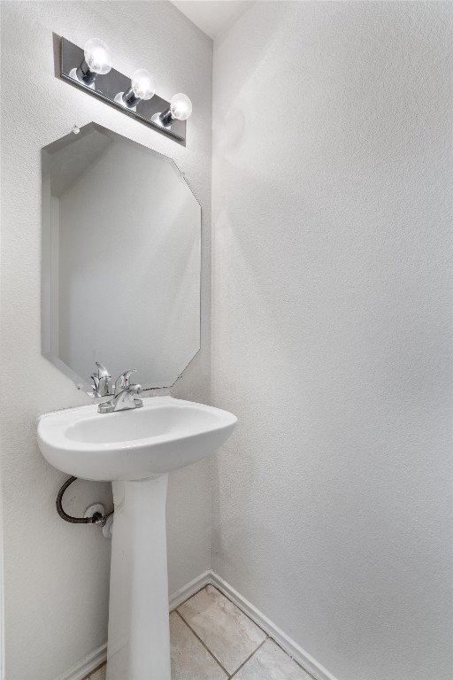 7432 Cayenne Lane Austin, TX 78741 - Photo 16 of 30 a bathroom with a sink and mirror