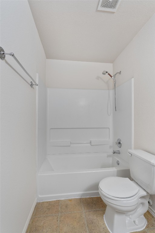 7432 Cayenne Lane Austin, TX 78741 - Photo 20 of 30 a bathroom with a toilet and a shower