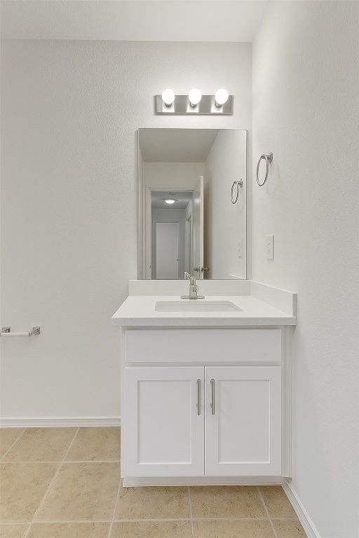7432 Cayenne Lane Austin, TX 78741 - Photo 9 of 30 a bathroom with a sink vanity and a mirror