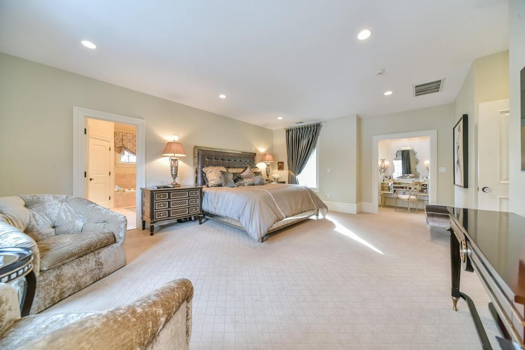 458 Heath Street Brookline, MA 02467 - Photo 13 of 28 a spacious bedroom with a bed and couch