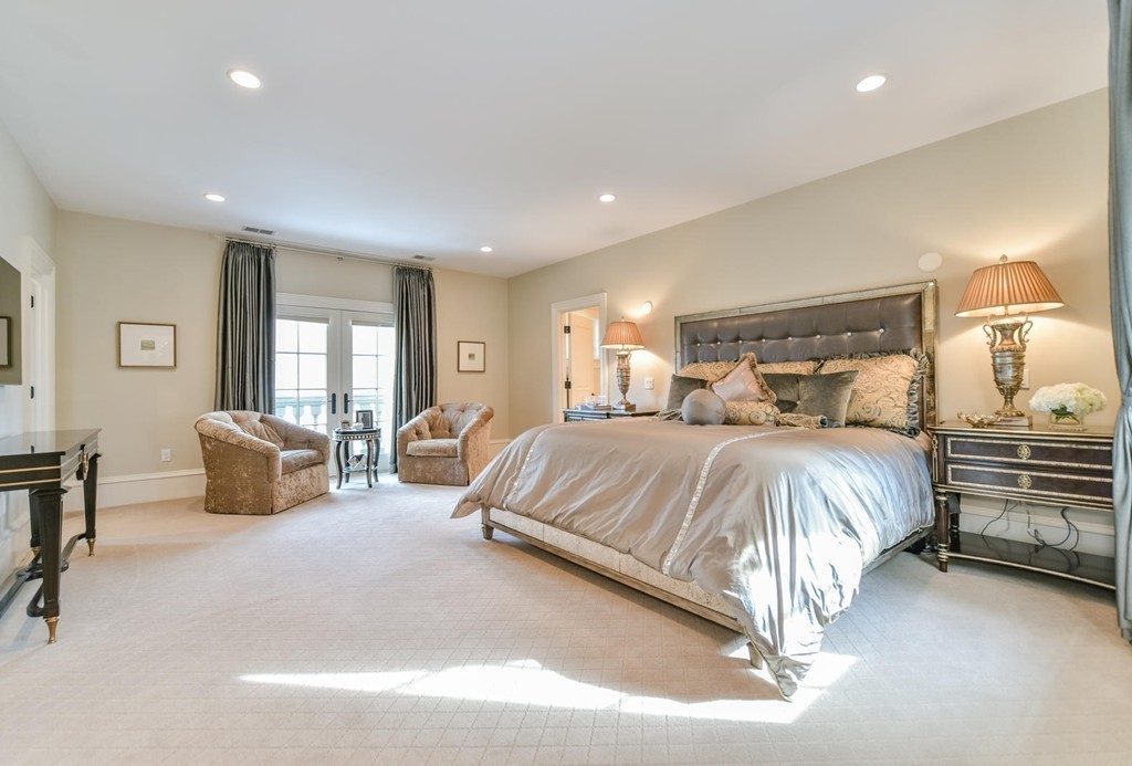458 Heath Street Brookline, MA 02467 - Photo 14 of 28 a spacious bedroom with a bed and wooden floor