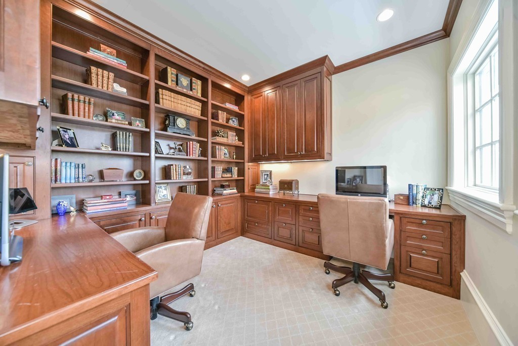 458 Heath Street Brookline, MA 02467 - Photo 17 of 28 a view of a workspace with furniture and a bookshelf