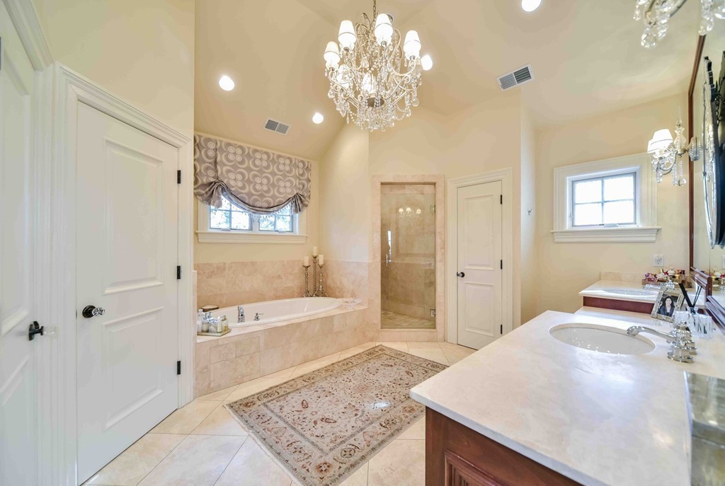 458 Heath Street Brookline, MA 02467 - Photo 19 of 28 a spacious bathroom with a sink a large mirror and a shower