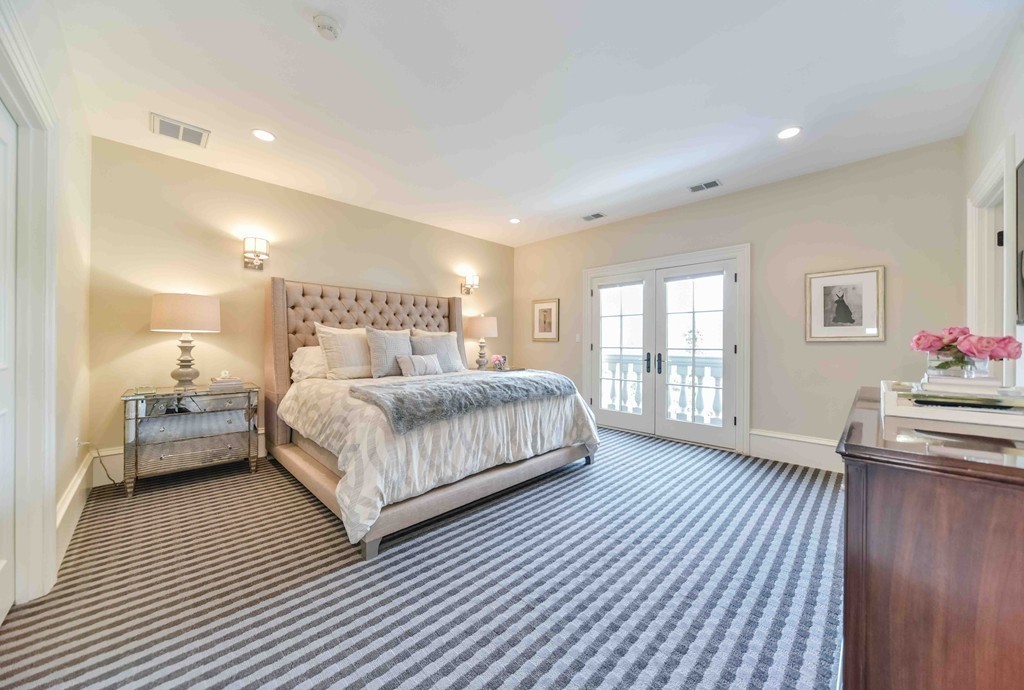 458 Heath Street Brookline, MA 02467 - Photo 22 of 28 a bedroom with a bed and wooden floor