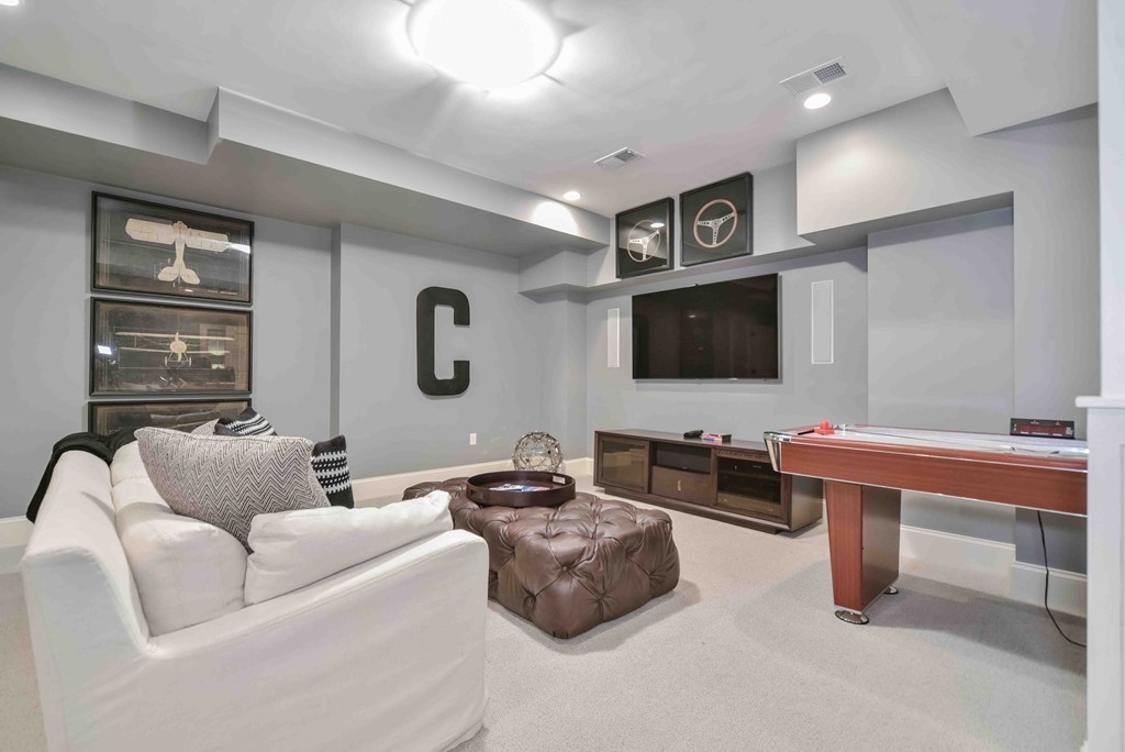 458 Heath Street Brookline, MA 02467 - Photo 23 of 28 a living room with furniture and a flat screen tv