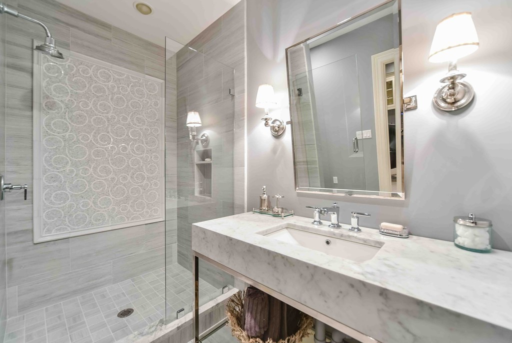 458 Heath Street Brookline, MA 02467 - Photo 26 of 28 a bathroom with a granite countertop sink a shower and a mirror