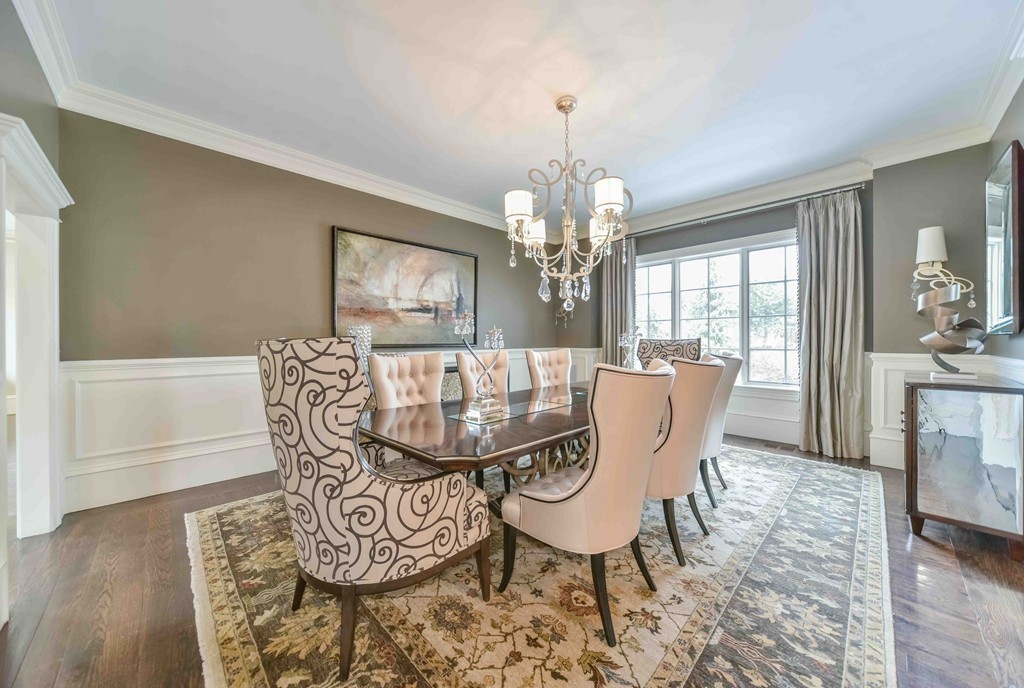 458 Heath Street Brookline, MA 02467 - Photo 8 of 28 a view of a dining room with furniture a chandelier and wooden floor