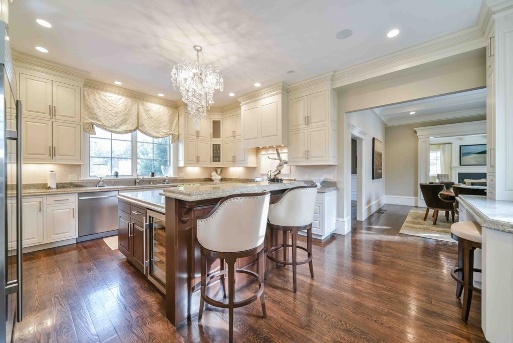 458 Heath Street Brookline, MA 02467 - Photo 10 of 28 a large kitchen with a table and chairs