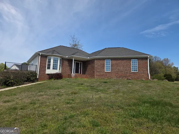 a front view of a house with garden
