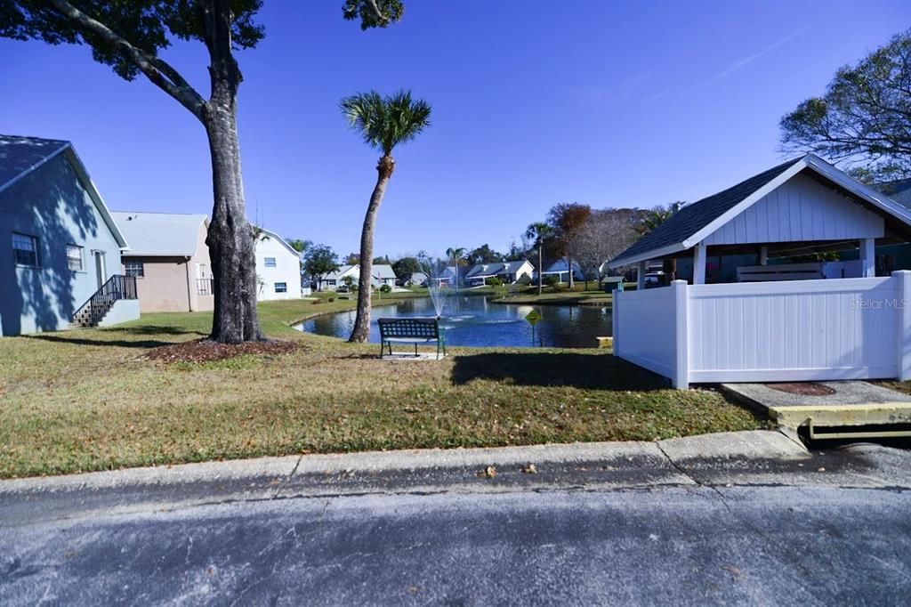 6715 Devonshire Lane, Unit 6715 New Port Richey, FL 34653 - Photo 35 of 38 The community lake with fountain is very soothing...