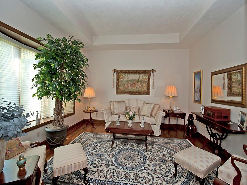 127 Hidden Valley Road Monroeville, PA 15146 - Photo 16 of 24 A formal living room with custom blinds and Walnut HW floors and tray ceilings is located right off main foyer.