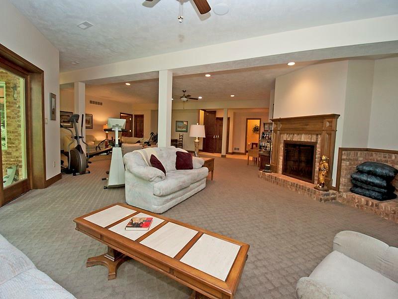 127 Hidden Valley Road Monroeville, PA 15146 - Photo 19 of 24 Den/Family/Great Room. Magnificent open and neutral decor. 2nd WB Fireplace w/Gas Starter is brick w/Walnut Mantel. Plumbed & Wired for 2nd Wet Bar. There is an Instant hot water & water filter system in home. Lower level has 2 spacious bedrooms, 2 full & 1 partial bath.