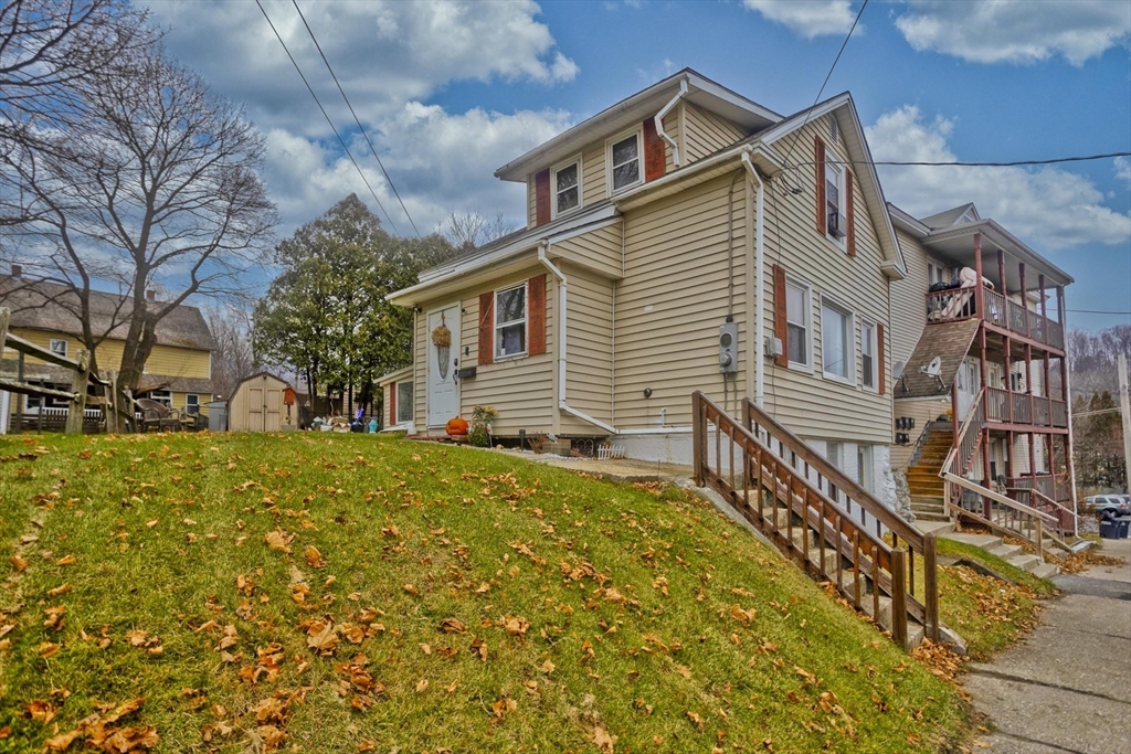 20 Prospect Street Adams, MA 01220 - Photo 1 of 27 a front view of a house with large trees