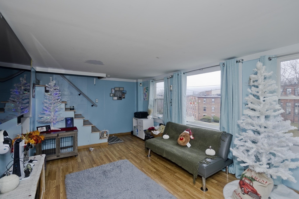 20 Prospect Street Adams, MA 01220 - Photo 11 of 27 a living room with furniture and a couch