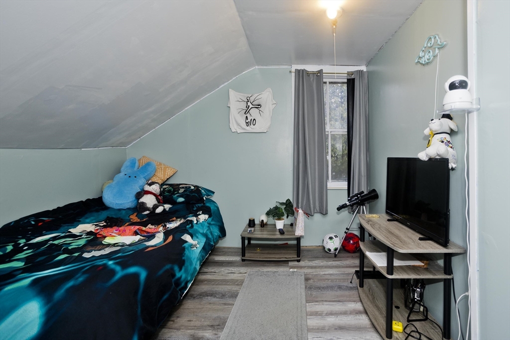 20 Prospect Street Adams, MA 01220 - Photo 14 of 27 a bedroom with a bed and flat screen tv