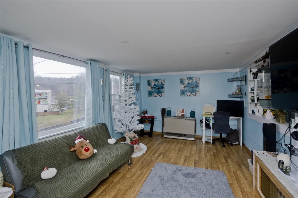 20 Prospect Street Adams, MA 01220 - Photo 3 of 27 a living room with furniture and a flat screen tv