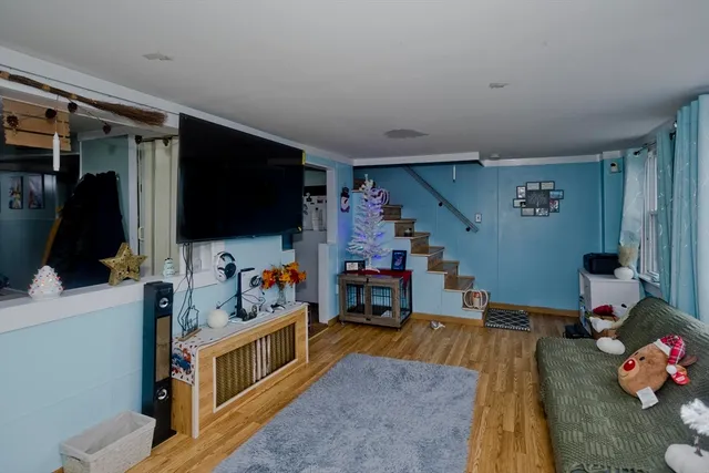 a room with furniture and a flat screen tv