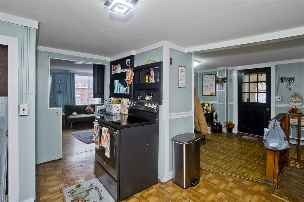 20 Prospect Street Adams, MA 01220 - Photo 6 of 27 a living room with furniture a window and gym equipment