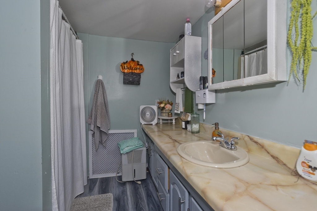 20 Prospect Street Adams, MA 01220 - Photo 8 of 27 a bathroom with a sink and a mirror