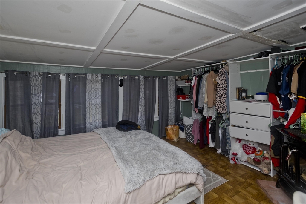 20 Prospect Street Adams, MA 01220 - Photo 10 of 27 a bed room with a bed and a walk in closet