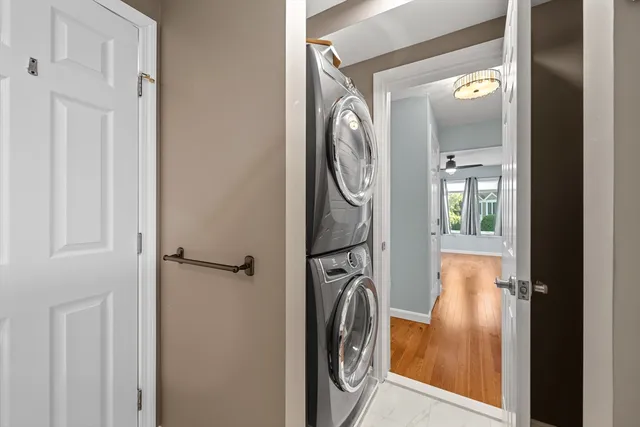 a view of a storage and utility room with washer and dryer