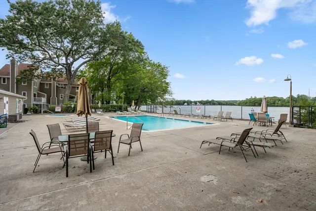 a view of a terrace with furniture and a garden