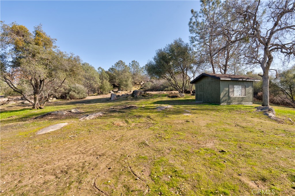 43956 Rocky Ridge Road Coarsegold, CA 93614 - Photo 47 of 58 a view of a swimming pool with an outdoor space
