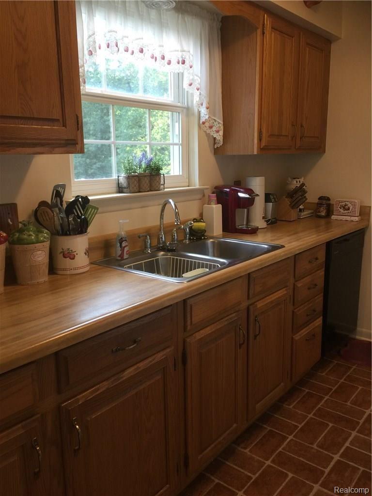 5773 Crandall Road Howell, MI 48855 - Photo 3 of 20 Kitchen has oak cabinets with nice view out back.