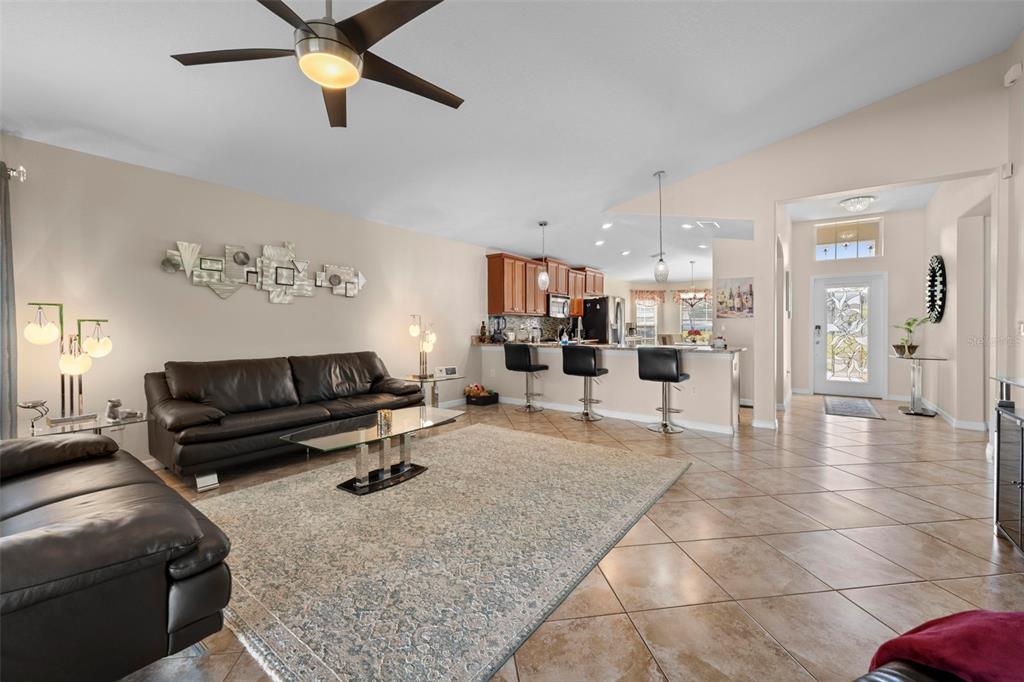 10114 Ives Loop Hudson, FL 34667 - Photo 11 of 49 a living room with furniture and kitchen view