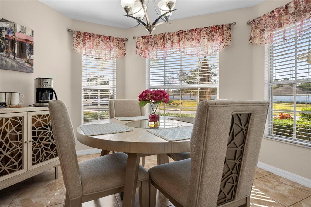 10114 Ives Loop Hudson, FL 34667 - Photo 18 of 49 a view of a dining room with furniture and window